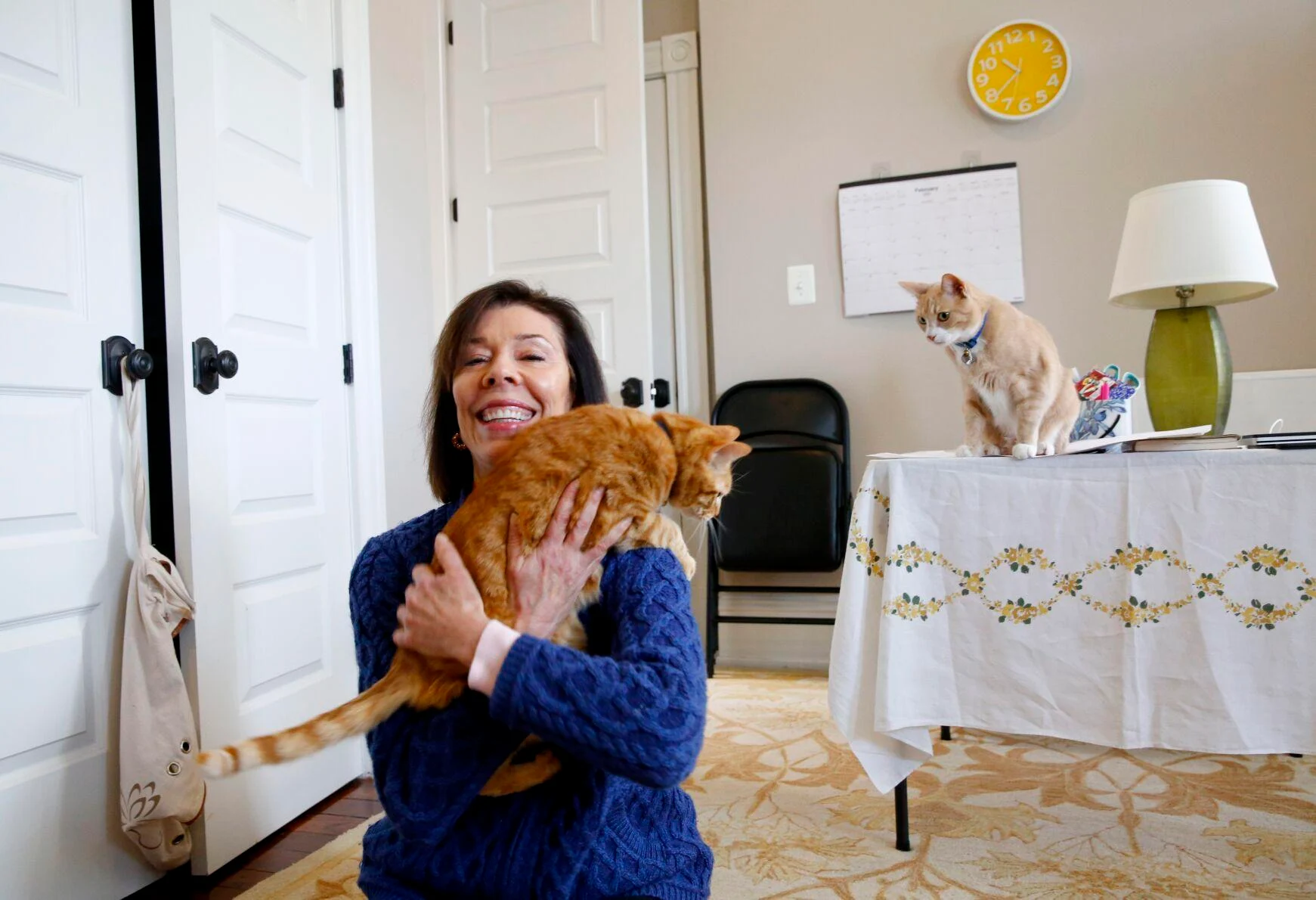 Susan Micari is shown with her cats, Rubilee and Loki, at her home in Richmond on Monday. Last fall, as a volunteer and via Zoom, Micari taught English, primarily to Afghan girls living in a safe house in Kabul.